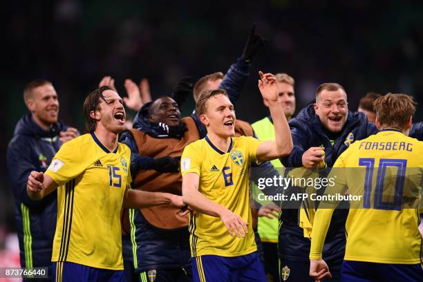 Sweden's players celebrate at the end of the FIFA World Cup 2018 qualification football match between Italy and Sweden, on November 13, 2017 at the...