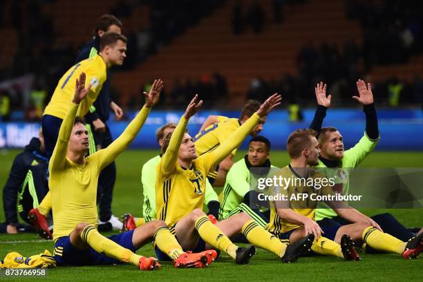 Sweden's players celebrate at the end of the FIFA World Cup 2018 qualification football match between Italy and Sweden, on November 13, 2017 at the...