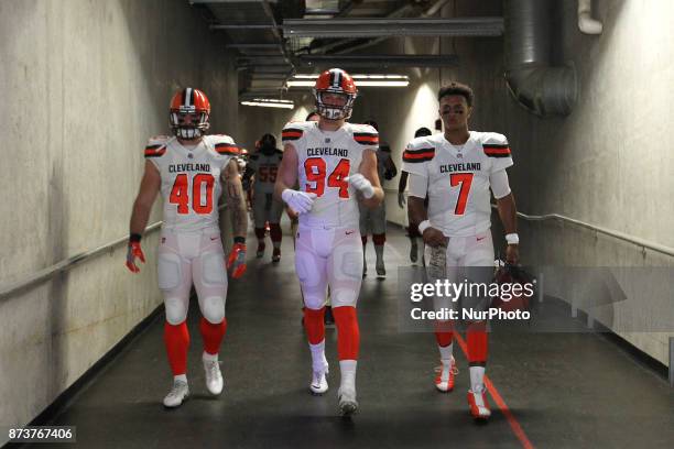 Cleveland Browns fullback Danny Vitale , defensive end Carl Nassib and quarterback DeShone Kizer walk out of the Ford Field tunnel during the first...