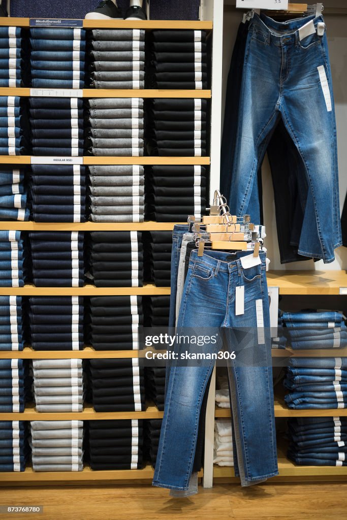 Vintage Denim jeans stack on shelves