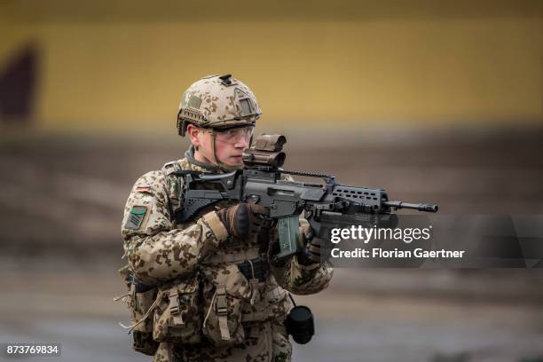 Soldier with equipment 'Infantryman of the Future - Extended System and ready to fire gun. Shot during an exercise of the land forces on October 13,...