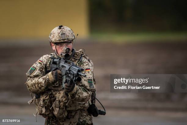 Soldier with equipment 'Infantryman of the Future - Extended System and ready to fire gun. Shot during an exercise of the land forces on October 13,...