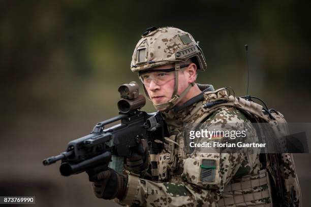 Soldier with equipment 'Infantryman of the Future - Extended System and ready to fire gun. Shot during an exercise of the land forces on October 13,...