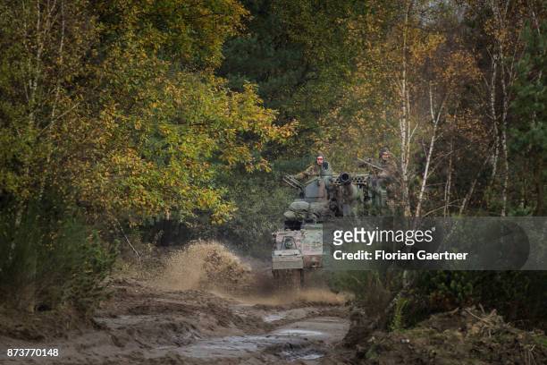 Manned tank howitzer 2000 drives through a forest. Shot during an exercise of the land forces on October 13, 2017 in Munster, Germany.