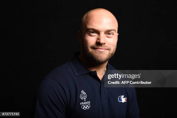 French skier David Poisson poses during the presentation ceremony of the French delegation to the Olympic Games in Pyeongchang, on October 4 in...