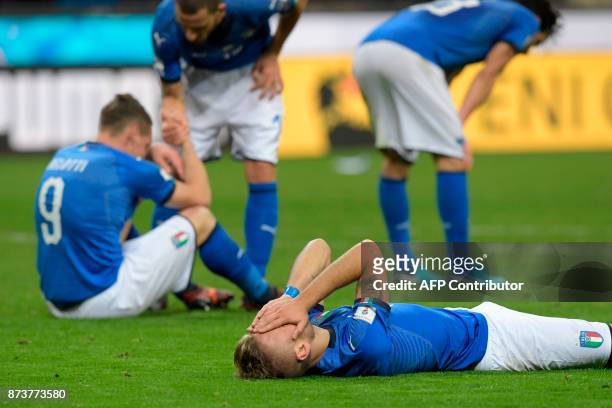 Italy's forward Ciro Immobile react at the end of the FIFA World Cup 2018 qualification football match between Italy and Sweden, on November 13, 2017...