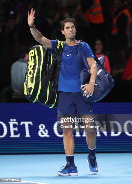 Rafael Nadal of Spain leaves the court after defeat in his Singles match against David Goffin of Belgium during day two of the Nitto ATP World Tour...