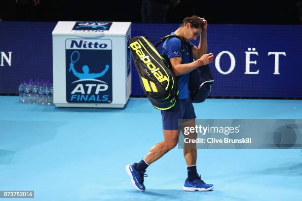 Rafael Nadal of Spain leaves the court after defeat in his Singles match against David Goffin of Belgium during day two of the Nitto ATP World Tour...