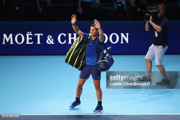Rafael Nadal of Spain leaves the court after defeat in his Singles match against David Goffin of Belgium during day two of the Nitto ATP World Tour...