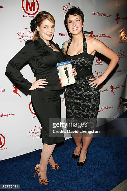 Writers Lily Burana and Diablo Cody pose with Burana's book "I Love a Man in Uniform" at the "Operation Bombshell" benefit event at Trader Vic's on...