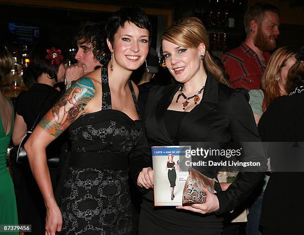 Writers Lily Diablo Cody and Lily Burana pose with Burana's book "I Love a Man in Uniform" at the "Operation Bombshell" benefit event at Trader Vic's...