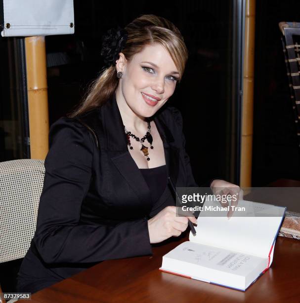 Author Lily Burana signs copies of her book "Operation Bombshell" a Burlesque Show and Benefit held at Trader Vic's At L.A. Live on May 15, 2009 in...