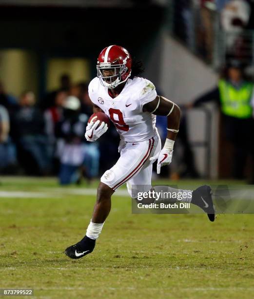 Bo Scarbrough of the Alabama Crimson Tide carries the ball during the second half of an NCAA football game against the Mississippi State Bulldogs at...