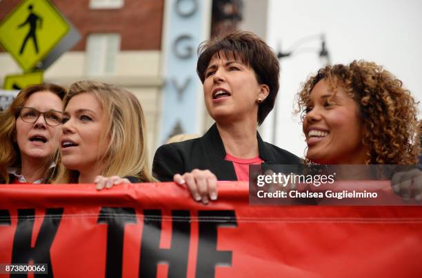 Elizabeth Perkins, Lauren Sivan and Connie Leyva seen at the Take Back The Workplace March on November 12, 2017 in Hollywood, California.