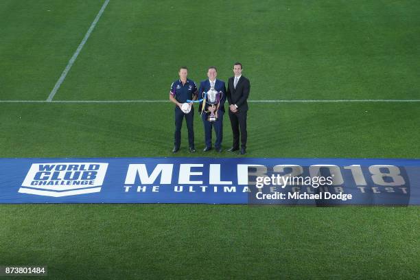 Melbourne Storm Head Coach Craig Bellamy Sports Minister John Eren MP and Storm CEO Dave Donaghy pose with the World Club Challenge Trophy during a...