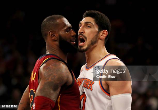 LeBron James of the Cleveland Cavaliers and Enes Kanter of the New York Knicks exchange words in the first half at Madison Square Garden on November...