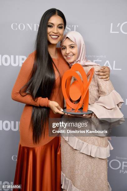 Lilly Singh and Muzoon Almellehan pose with an award backstage at the Glamour's 2017 Women of The Year Awards at Kings Theatre on November 13, 2017...