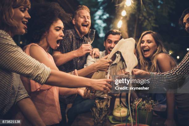 opening champagne can be fun! - spritz drink stock pictures, royalty-free photos & images