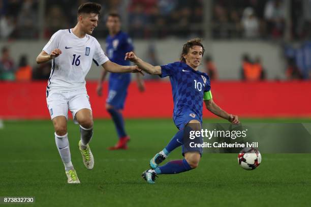 Dimitris Kourbelis of Greece and Luka Modric of Croatia during the FIFA 2018 World Cup Qualifier Play-Off: Second Leg between Greece and Croatia at...