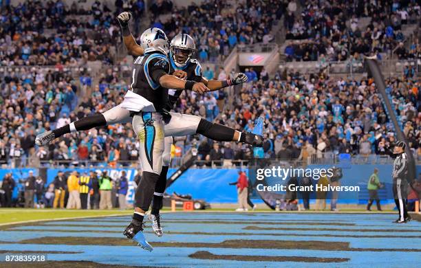 Cam Newton and Devin Funchess of the Carolina Panthers celebrate after a touchdown against the Miami Dolphins during their game at Bank of America...