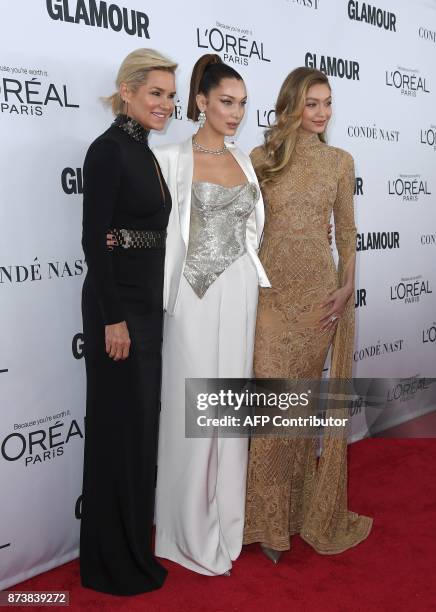 Yolanda, Bella and Gigi Hadid attend Glamour's 2017 Women of The Year Awards at Kings Theatre on November 13, 2017 in Brooklyn, New York. / AFP PHOTO...