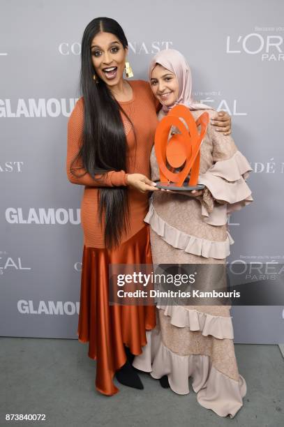 Lilly Singh and Muzoon Almellehan pose backstage at Glamour's 2017 Women of The Year Awards at Kings Theatre on November 13, 2017 in Brooklyn, New...