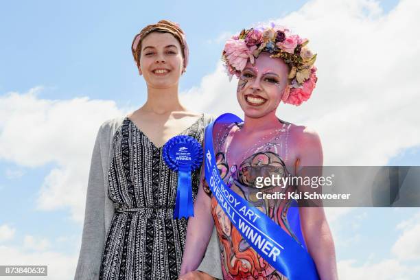 Artist Daisy Tait and model Zoe Phillips pose after winning the Body Art contest during New Zealand Trotting Cup Day at Addington Raceway on November...
