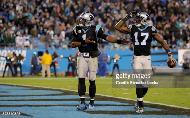 Cam Newton and teammate Devin Funchess of the Carolina Panthers celebrate a touchdown against the Miami Dolphins in the third quarter during their...