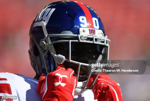 Jason Pierre-Paul of the New York Giants looks on during pregame warm ups prior to the start of an NFL football game against the San Francisco 49ers...