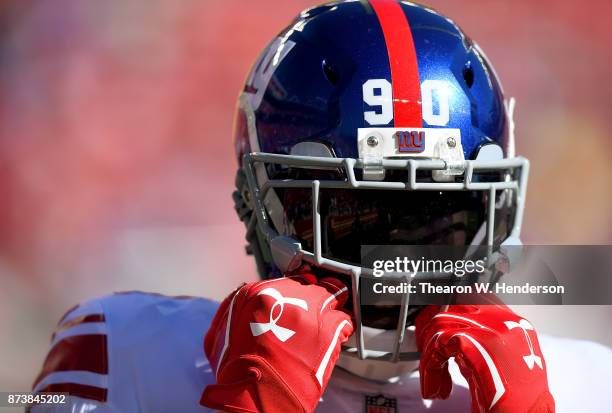 Jason Pierre-Paul of the New York Giants looks on during pregame warm ups prior to the start of an NFL football game against the San Francisco 49ers...