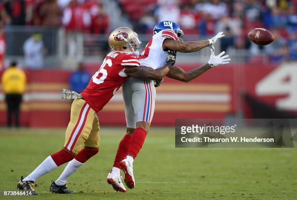 Roger Lewis of the New York Giants catches a pass over Dontae Johnson of the San Francisco 49ers during their NFL football game at Levi's Stadium on...
