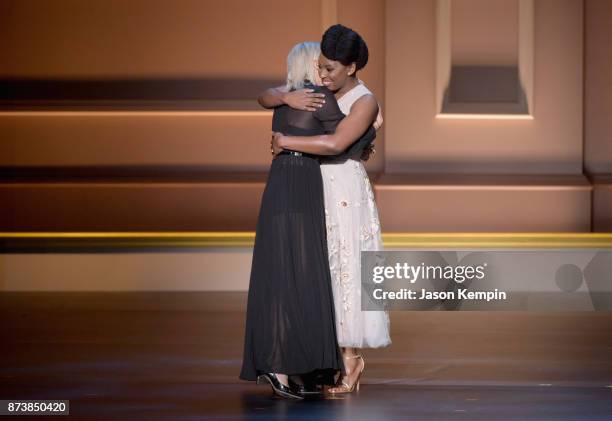 Maria Grazia Chiuri embraces Chimamanda Ngozi Adichie onstage at Glamour's 2017 Women of The Year Awards at Kings Theatre on November 13, 2017 in...