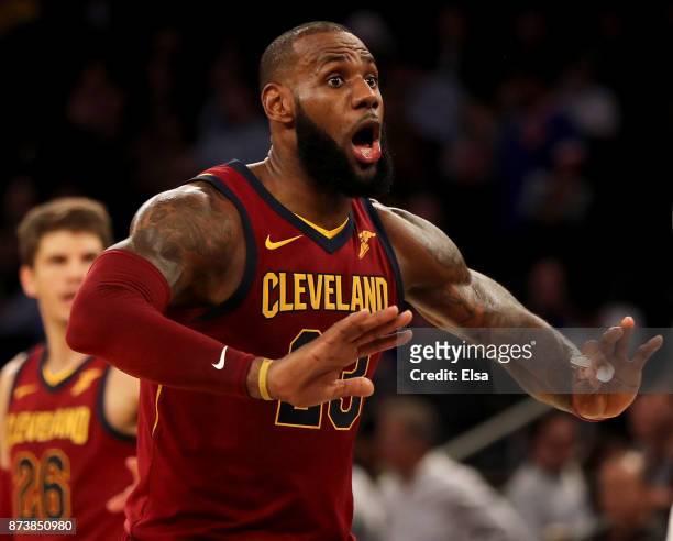 LeBron James of the Cleveland Cavaliers directs his teamamtes in the final minute of the game against the New York Knicks at Madison Square Garden on...