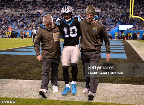 Curtis Samuel of the Carolina Panthers is helped off of the field during their game against the Miami Dolphins at Bank of America Stadium on November...