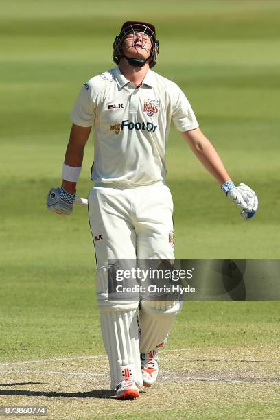 Matthew Renshaw of Queensland leaves the field after being dismissed by Doug Bollinger of New South Wales during day two of the Sheffield Shield...