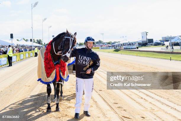 Driver Mark Purdon and Lazarus celebrate after winning Race10 Christchurch Casino NZ Trotting Cup during New Zealand Trotting Cup Day at Addington...