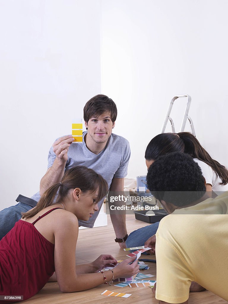 Group of friends choosing paint colours