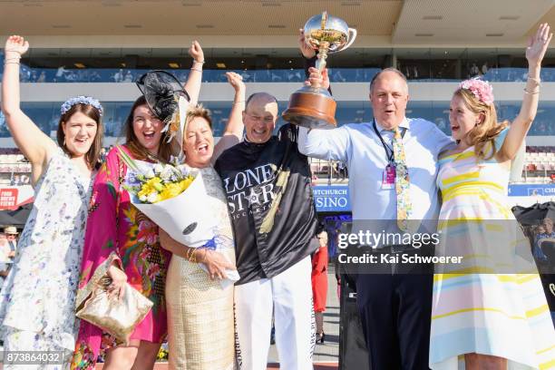 Driver Mark Purdon celebrates with co-owners of Lazarus, Glenys Kennard and Phil Kennard and their daughters after winning Race10 Christchurch Casino...