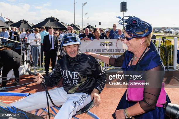 Driver Mark Purdon celebrates with co-owner of Lazarus, Kate Marriott after winning Race10 Christchurch Casino NZ Trotting Cup during New Zealand...