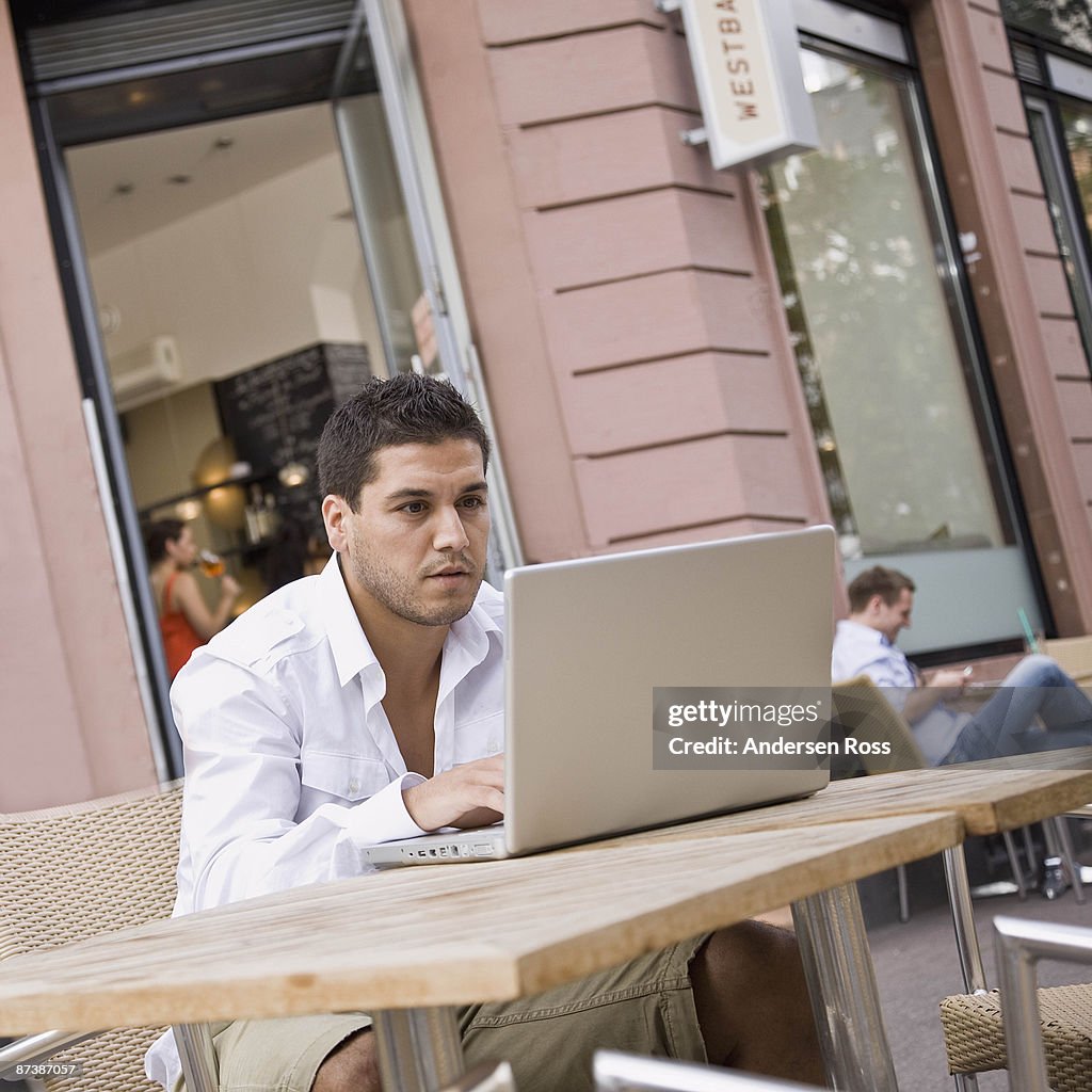 Man outside on laptop