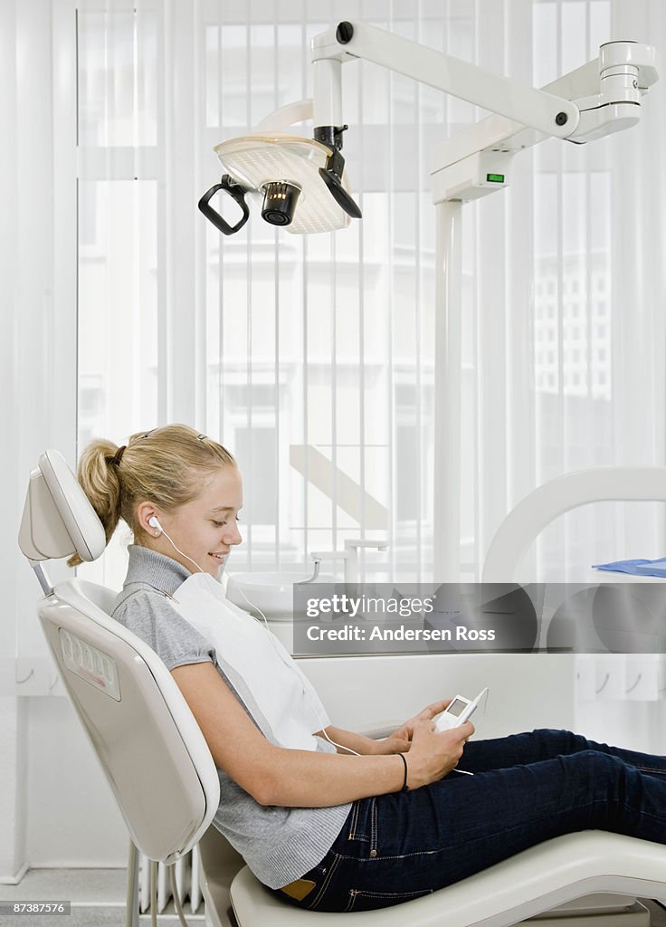 Dental patient listening to mp3 player