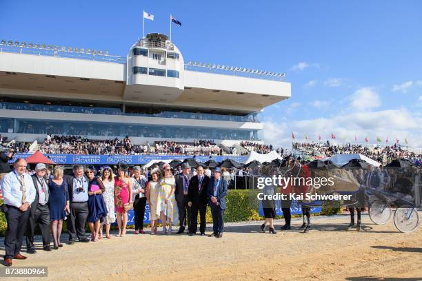 Driver Mark Purdon celebrates with co-owners of Lazarus after winning Race10 Christchurch Casino NZ Trotting Cup during New Zealand Trotting Cup Day...