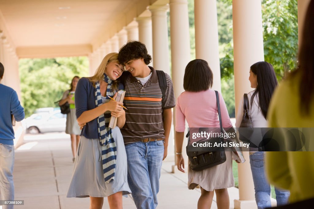 Teenage couple walking together