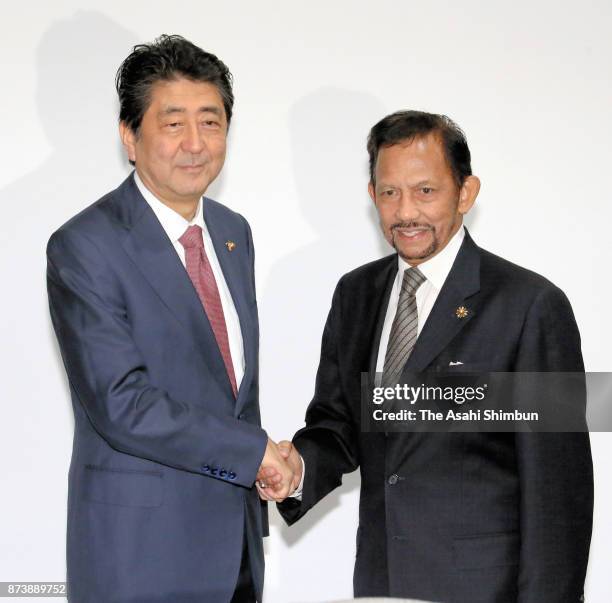 Japanese Prime Minister Shinzo Abe and Sultan Hassanal Bolkiah of Brunei Darussalam shake hands prior to their meeting on November 13, 2017 in...