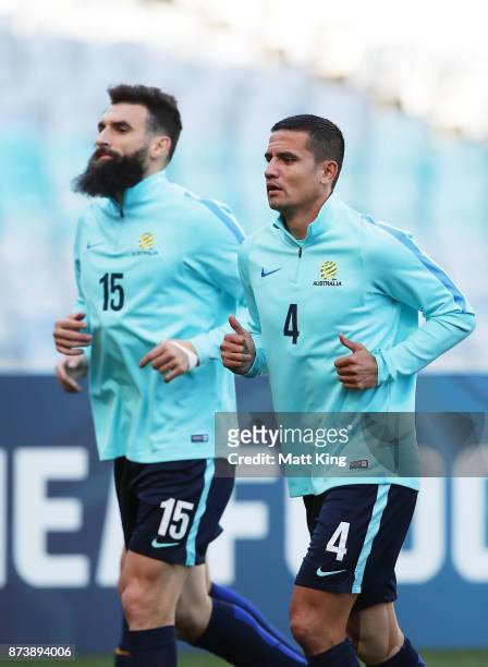 Mile Jedinak and Tim Cahill of Australia warm up during an Australian Socceroos training session at ANZ Stadium ahead of their World Cup 2018...