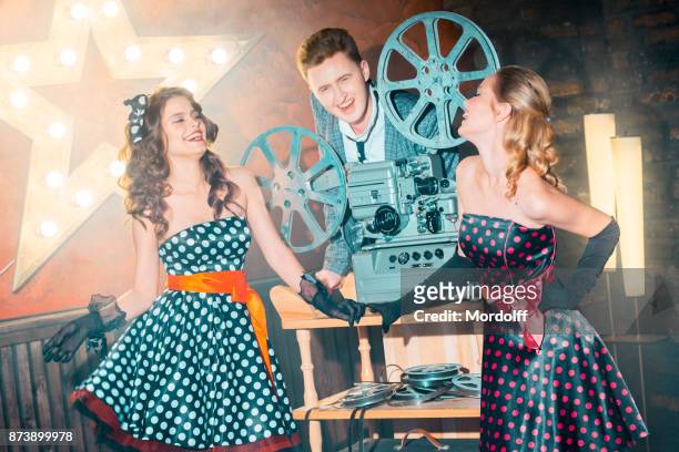 projectionist flirting with beautiful girls - projectionist stock pictures, royalty-free photos & images