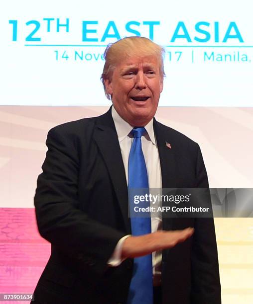 President Donald Trump talks to the press after attending the 31st Association of Southeast Asian Nations Summit in Manila on November 14, 2017. The...