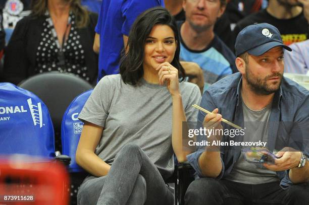 Model Kendall Jenner and producer Michael D. Ratner attend a basketball game between the Los Angeles Clippers and the Philadelphia 76ers at Staples...