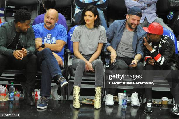 Model Kendall Jenner, producer Michael D. Ratner and boxer Floyd Mayweather attend a basketball game between the Los Angeles Clippers and the...