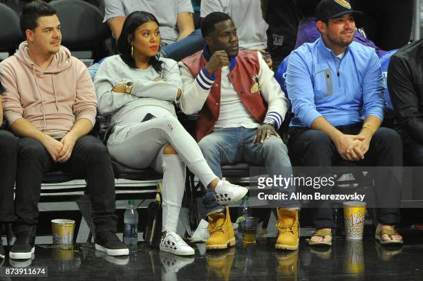 Actor Kevin Hart and wife Eniko Parrish attend a basketball game between the Los Angeles Clippers and the Philadelphia 76ers at Staples Center on...
